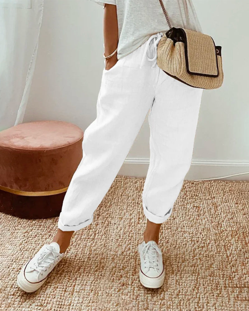 Calças de algodão casuais com bolsos e cordão