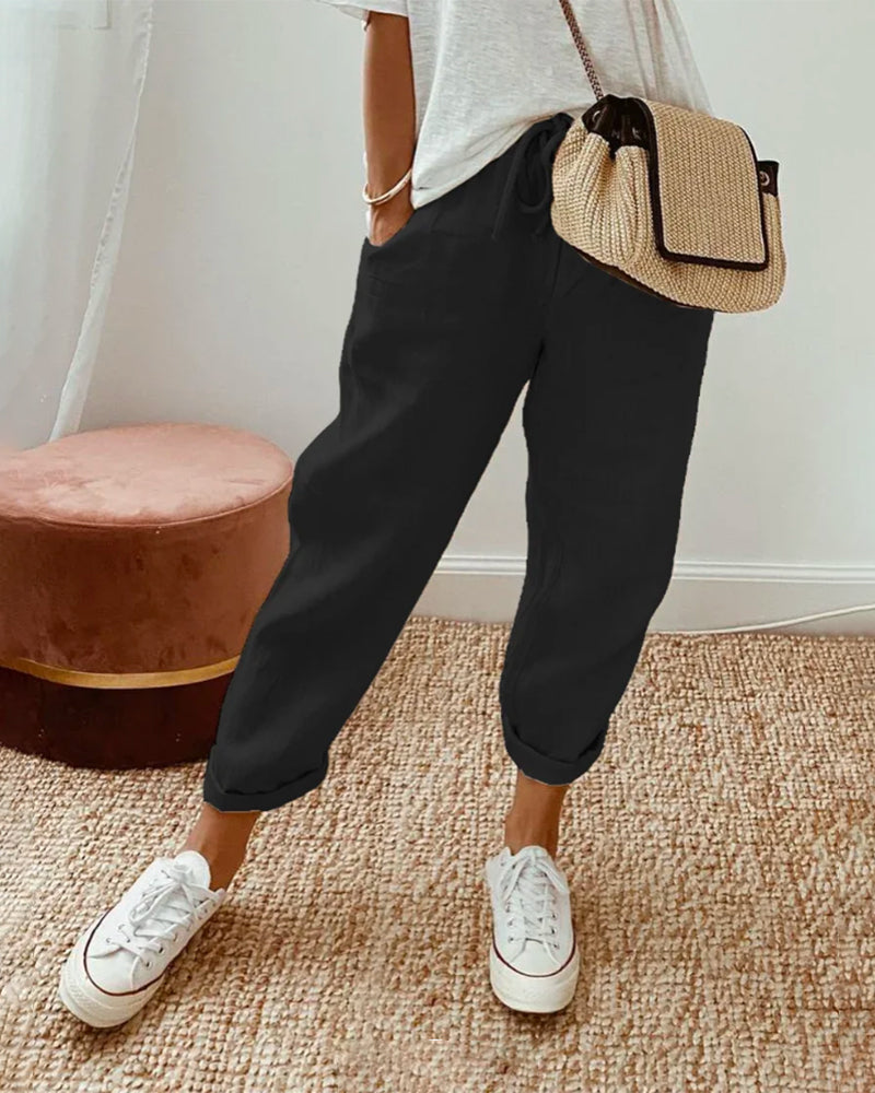 Calças de algodão casuais com bolsos e cordão